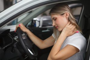 Woman having neck pain after a car accident