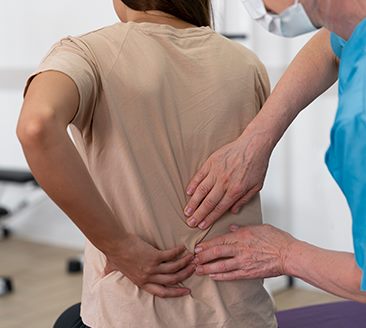 Chiropractor treating a patient